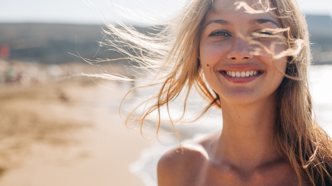 Smiling Lady By The Beach