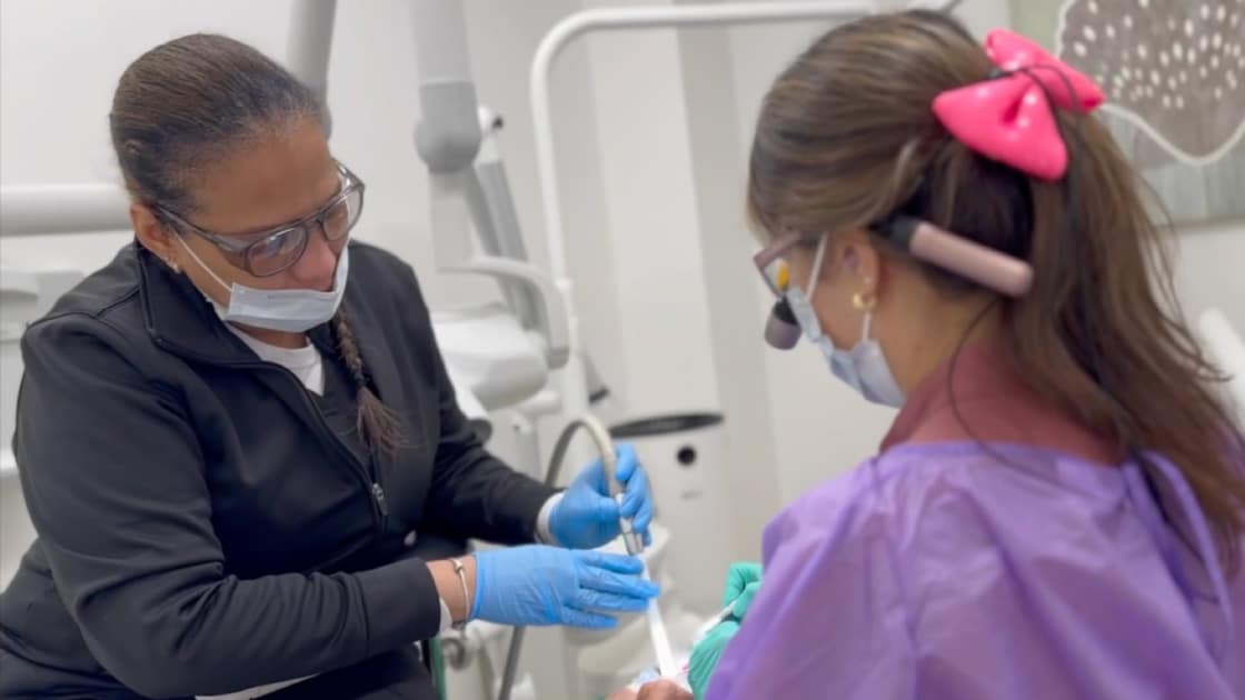 Doctor Working With Hygienist 